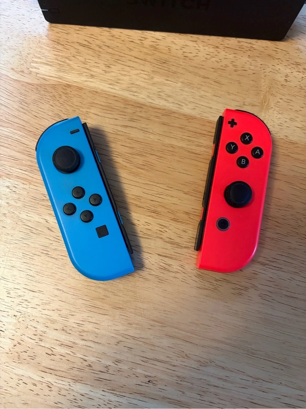 Nintendo Switch with Neon Red & Neon Blue Joy‑Con and Five Games